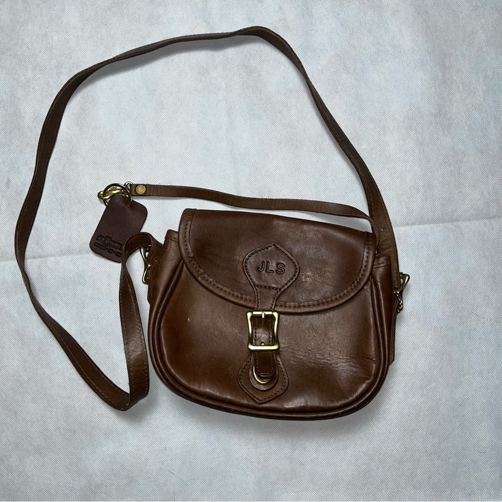 J. W. Hulme Co brown leather saddle crossbody bag